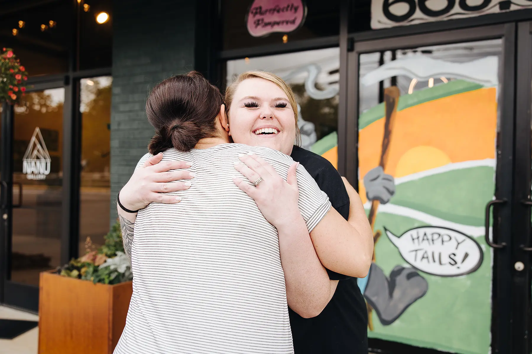 Purrfectly Pampered Pet Spa owners embracing, McDowell County, NC